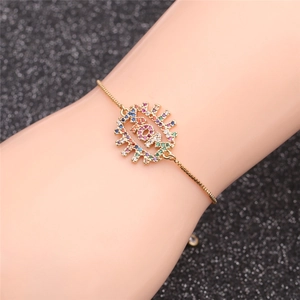 Detail of adjustable gold MOM bracelet with colorful zircon stones on woman wrist