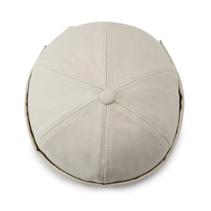 Minimalist beige cotton docker hat featuring a classic six-panel design and rolled edge