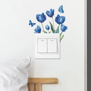 Romantic blue tulip and butterfly wall sticker decorating a light switch in a cozy bedroom