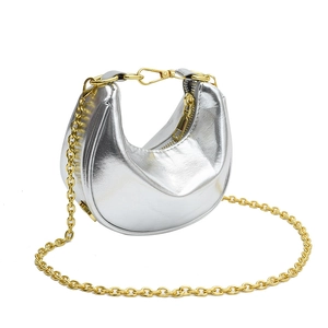 Silver crescent moon shoulder bag with golden chain strap and metallic finish leather
