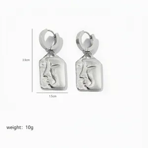 Detailed view of silver face profile earrings measuring 3.9cm by 1.5cm with 10g weight