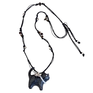 Handcrafted black cat pendant necklace with pearl collar and floral beads on woven cord