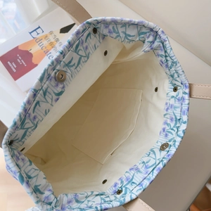 Detail view of floral cotton tote bag interior with magnetic closure and inner pocket