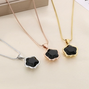 Clover snake chain necklaces in gold, rose gold, and silver with black floral pendant