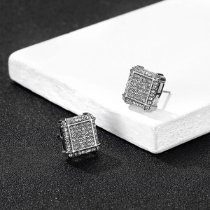 Macro shot of silver square micro-pave stud earrings with white cubic zirconia stones