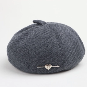 Close-up of dark grey knitted beret featuring twill texture and silver heart metal buckle