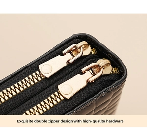 Detail of black quilted leather card holder with premium double golden zippers