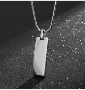 Detailed view of polished silver rectangle pendant with premium snake chain accessory