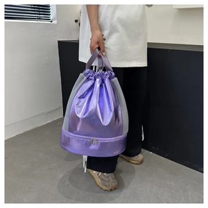 Detail of purple metallic drawstring bag with breathable mesh and bottom compartment