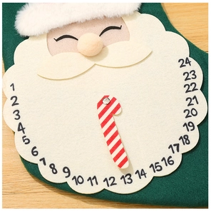 Detail of green felt advent calendar stocking with Santa design and 24-day countdown feature
