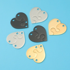 Polished stainless steel interlocking heart puzzle pendants in black silver and gold