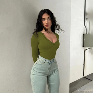 Detailed view of the olive green ribbed knit texture and wide U-neckline of this bodysuit