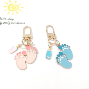 Cute pink and blue baby bottle and footprint charms made of alloy for DIY keychains