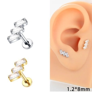 Macro view of 1.2x8mm G23 titanium labret stud with rectangular zircon on ear model