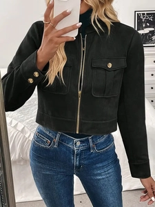 Detail of black suede short jacket featuring gold buttons and metallic zipper closure