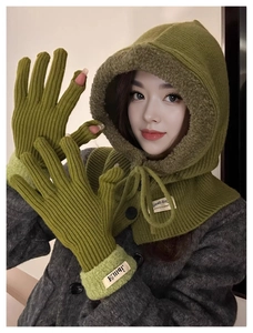 Close-up of green knitted balaclava scarf set with matching fingerless winter gloves