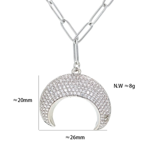 Detail view of crescent moon pendant with rhinestones including size 26x20mm and weight 8g