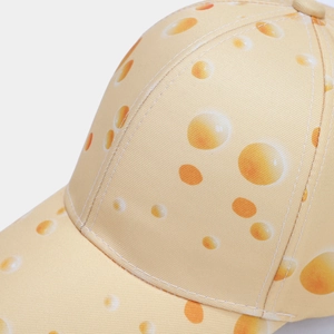 Detail of cheese pattern print on twill cotton baseball cap with quality stitching