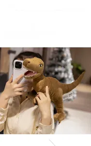 Detail of a brown plush dinosaur toy with realistic skin texture and sharp white teeth