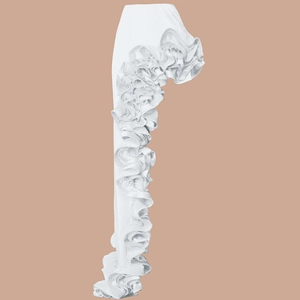 Detailed view of layered white ruffles on the side of a V-neck swimsuit skirt