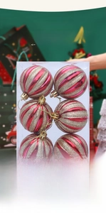 Detail view of 6cm red and gold striped Christmas ornaments in clear packaging box