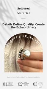 Detailed view of vintage two-tone ring with large pearl and small diamond accents