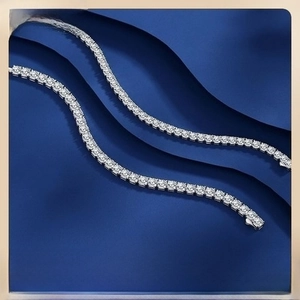 Macro view of S925 sterling silver tennis chains featuring precision-set brilliant stones
