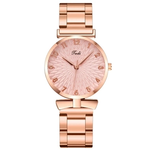 Detail view of the rose gold women's watch with a textured pink sunburst dial and markers
