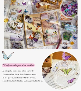 Detail of vintage butterfly PET stickers on journal pages with close-up texture