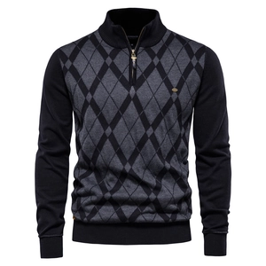 Detail of grey diamond pattern on men's half-zip knit sweater with metal logo