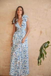Detail of floral deep V-neck maxi dress with ruffles and side waist cut-outs for vacation