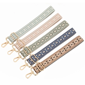 Adjustable bohemian style woven bag straps with colorful geometric patterns and gold clips