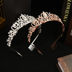 Detailed close-up of silver and rose gold bridal crowns with sparkling rhinestones