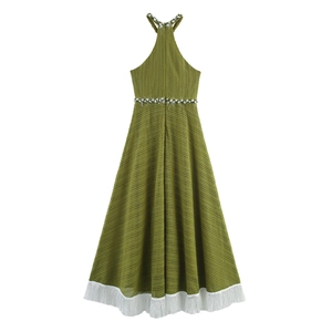 Detail of green hollow-out crochet maxi dress featuring a back view with white fringe hem