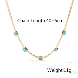 Detail of gold snake chain with green turquoise gemstones and size specifications