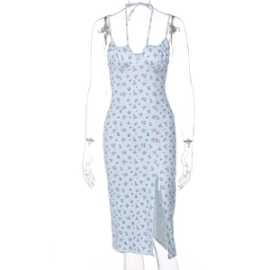 Detail of light blue floral dress with halter neck, bust ruching and side slit design