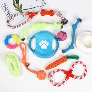 Flat lay of 10-piece durable cotton rope dog toy set with frisbee and rubber chew rings