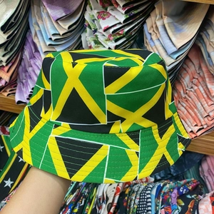 Detail view of cotton sun hat featuring vibrant Jamaican flag colors and canvas texture