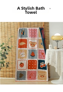 Close-up of four-layer cotton gauze bath towel with colorful cartoon animal patterns