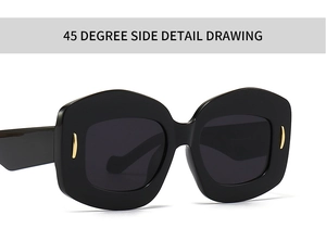 Detailed 45-degree side view of irregular hexagonal black sunglasses with gold metal accents