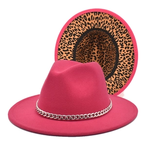Detail view of pink wool felt fedora with leopard print lining and silver chain band decor