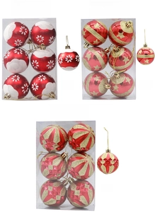 Detailed view of hand-painted red and gold Christmas ornaments set with star patterns