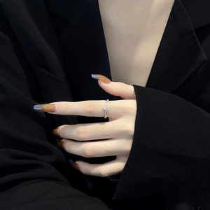Elegant adjustable rose gold ring with pink heart cubic zirconia on female model hand
