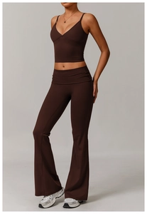 Detail of eco-friendly brown yoga set featuring V-neck cropped tank top and flared leggings