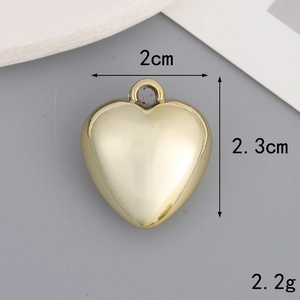 Detailed view showing a 2cm x 2.3cm golden heart pendant with dimension and weight labels