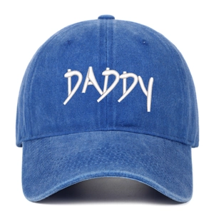 Detailed view of DADDY embroidery on blue washed denim cotton vintage baseball cap