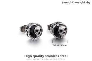 Detail shot of vintage skull stud earrings with black gemstone in stainless steel