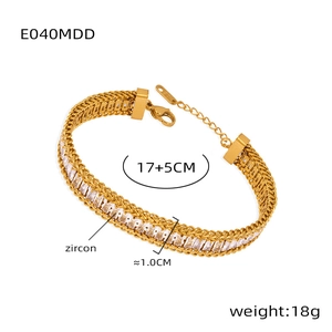 Detail view of gold dragon chain bracelet with zircon stones and adjustable link clasp