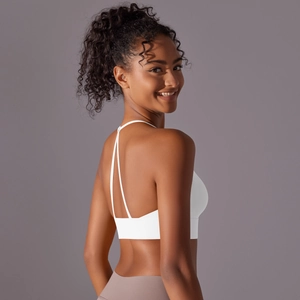 Close-up of white sports bra featuring a Y-shaped back and minimalist thin straps