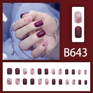 Short square press-on nails in wine red and marbled pink duo-tone glossy finish